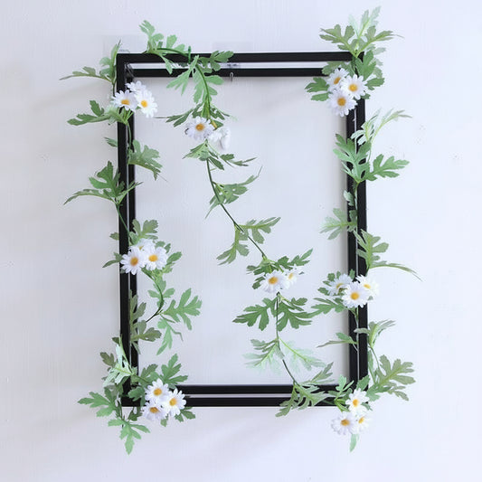Faux floral vine styled for indoor wall and shelf decoration