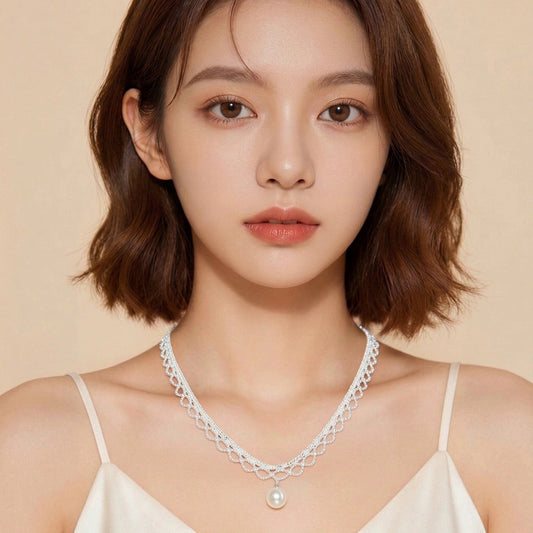 Silver lace collar pearl drop necklace worn at the collarbone