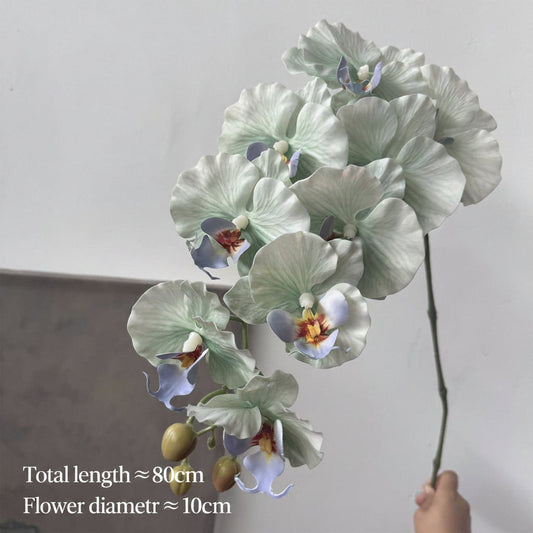 White artificial orchid bouquet for memorial table decor
