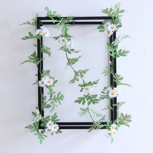 Faux floral vine styled for indoor wall and shelf decoration
