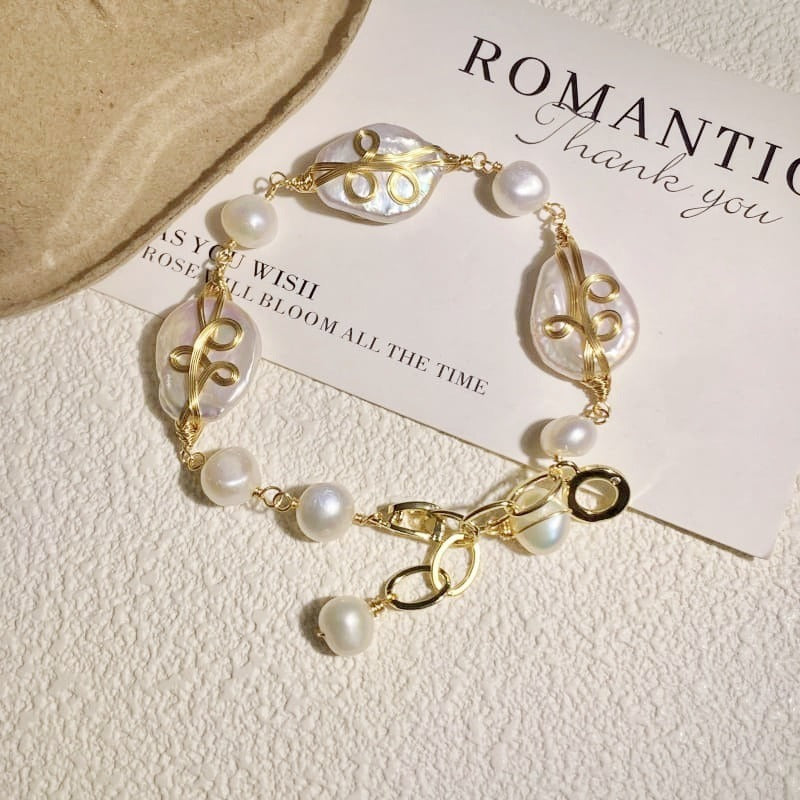 Wire-wrapped baroque pearl bracelet in a circle