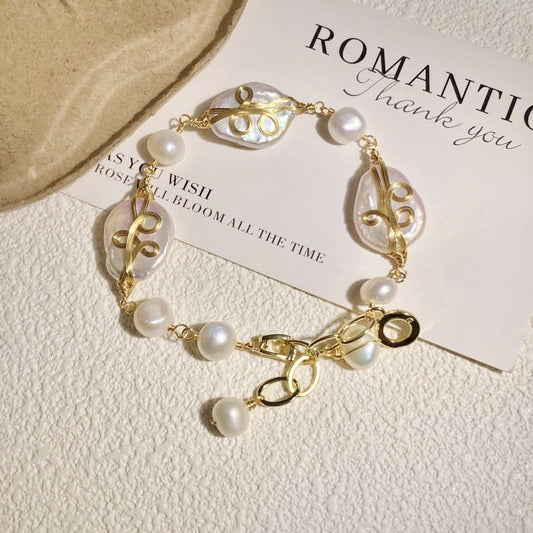 Wire-wrapped baroque pearl bracelet in a circle