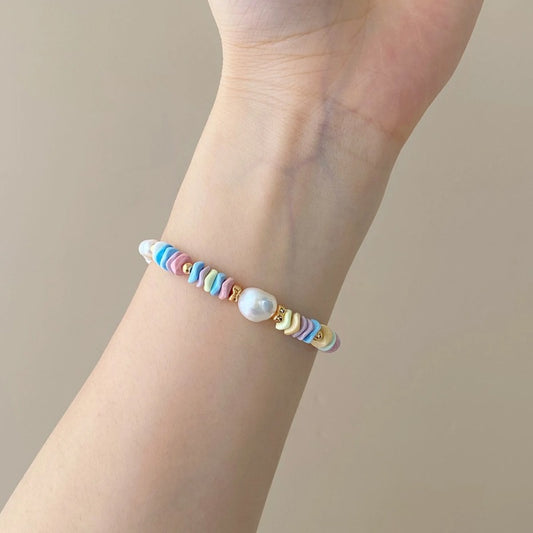 Pastel chip bead pearl bracelet worn on the wrist