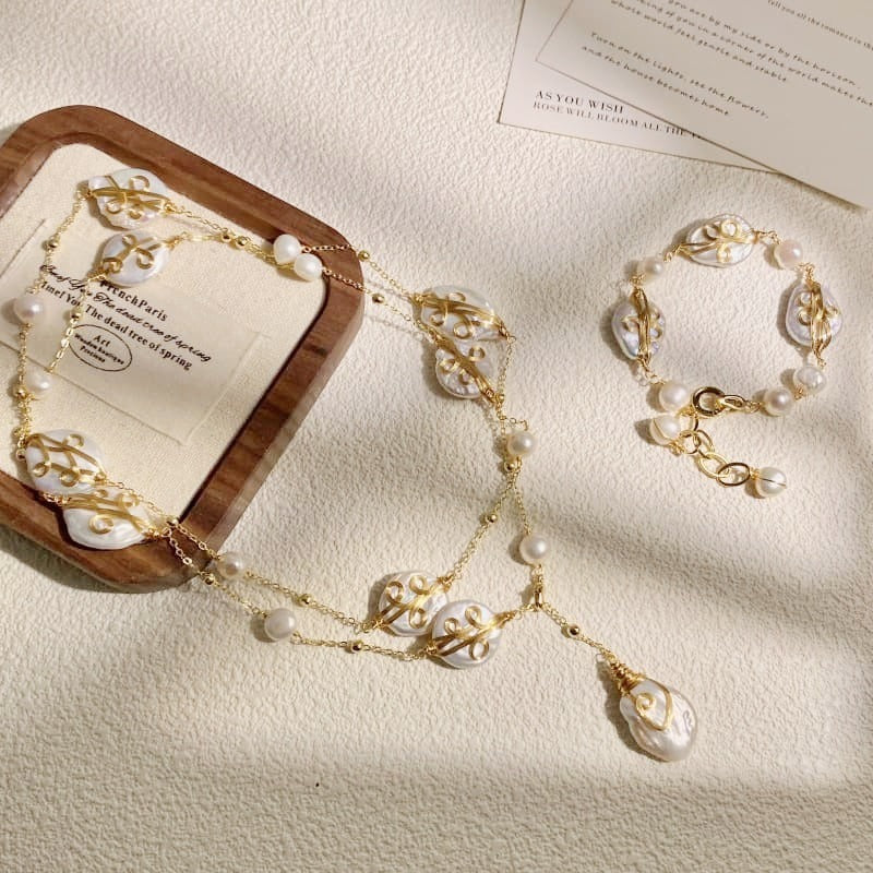 Wire-wrapped baroque pearl lariat with matching bracelet