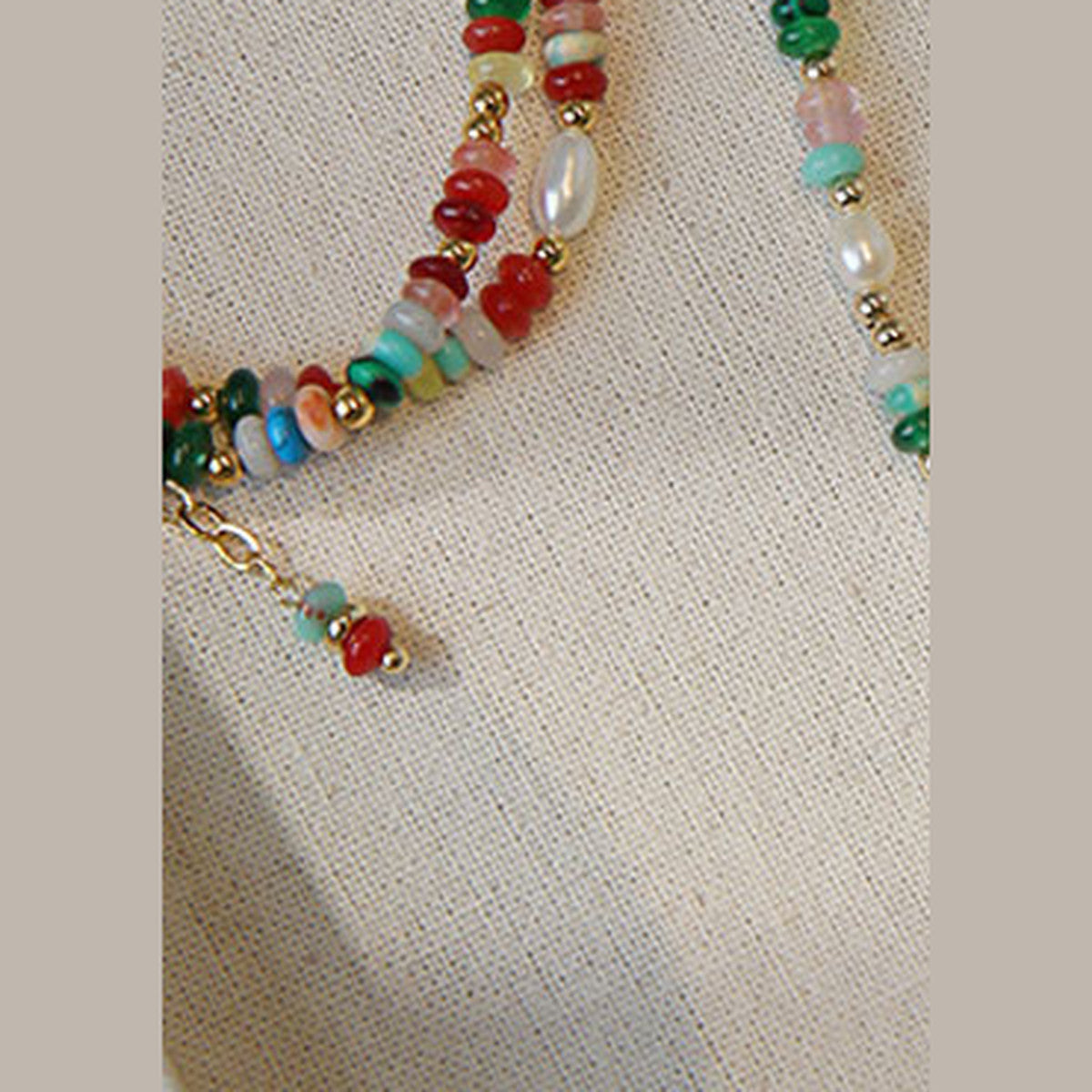 Colorful heishi discs, rice pearls and gold spacers on the mixed bead bracelet