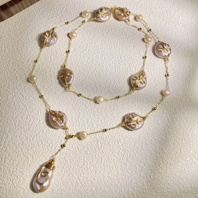 Blush baroque coin pearls in gold-tone wire wrap