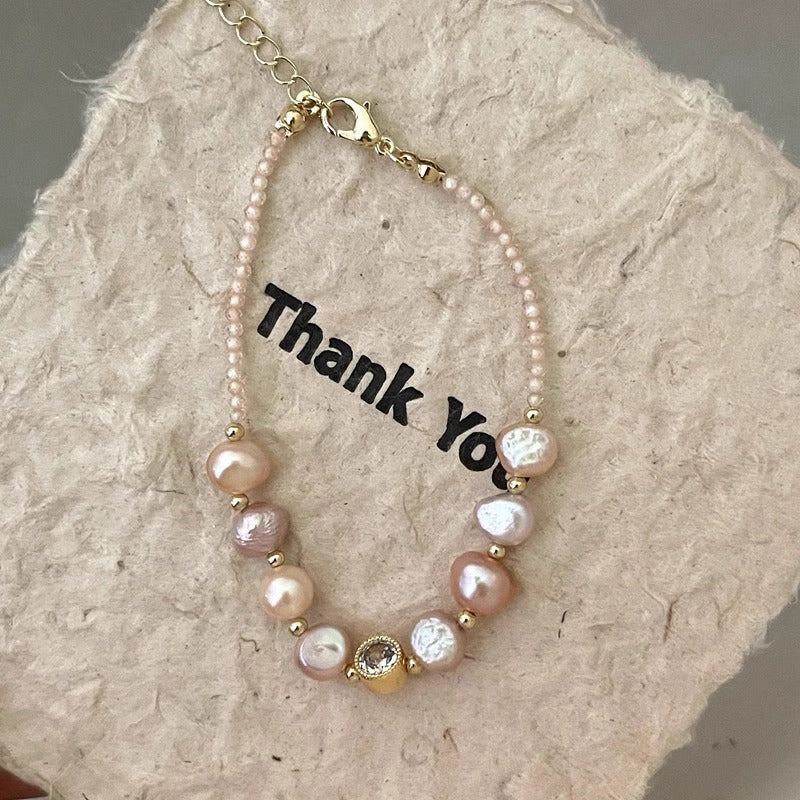 Blush baroque pearl and crystal bracelet on paper