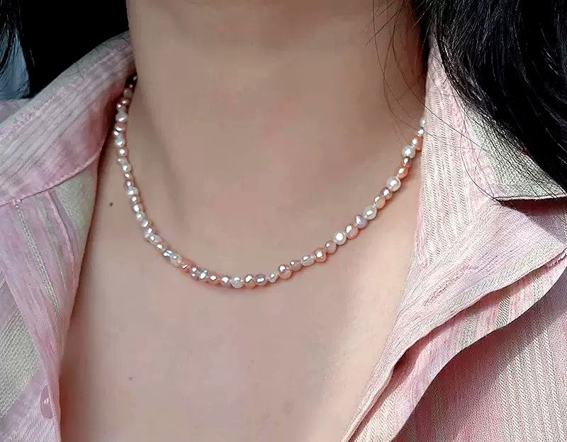 Baroque freshwater pearl necklace worn at the collarbone