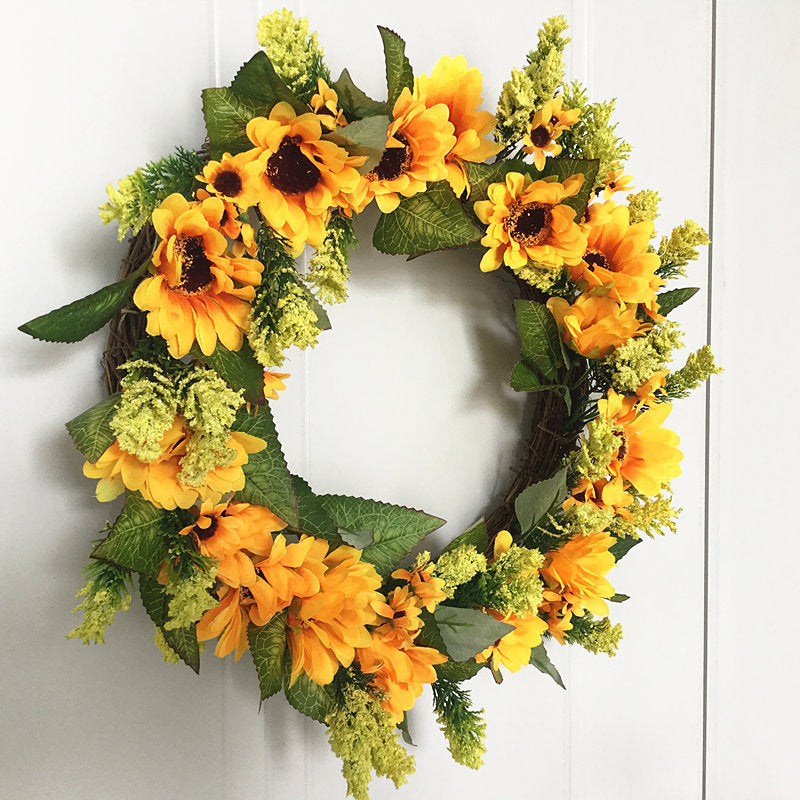 Faux sunflower wreath detail with yellow petals