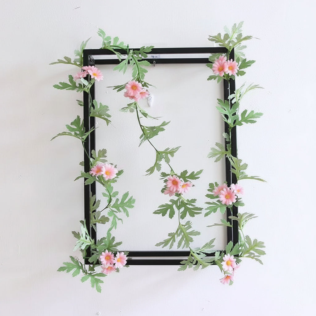 Artificial flower vine detail with daisy and sunflower styling