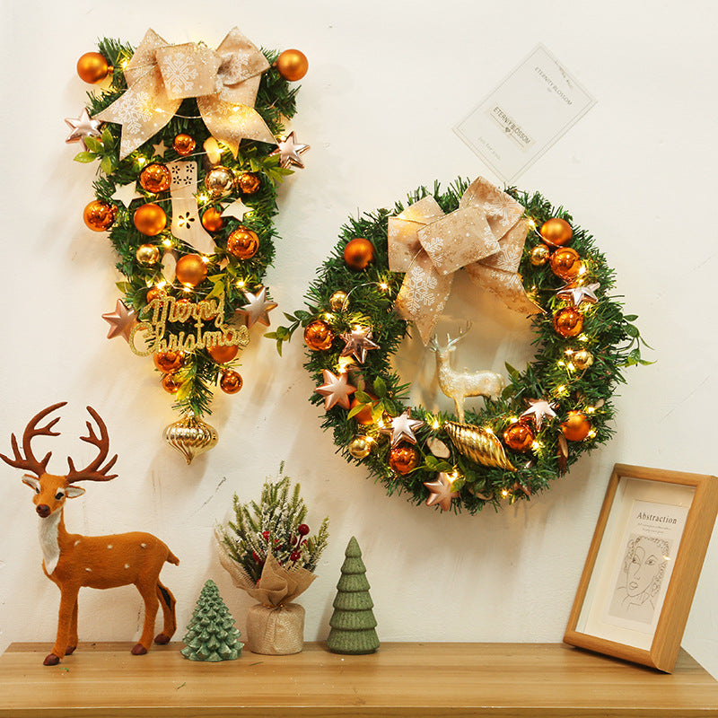 Christmas tree ornament wall hanging with holiday greenery